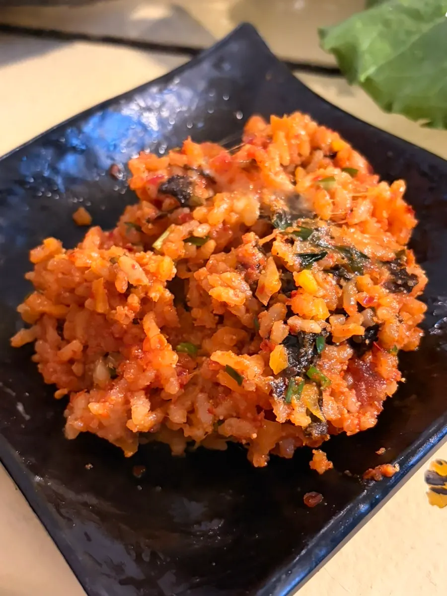 Pollock roe stone-pot fried rice topped with cheese