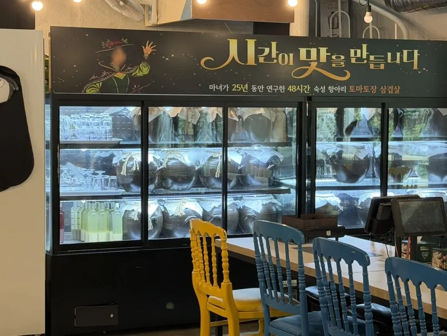 Creek-view outdoor seating with yellow parasols