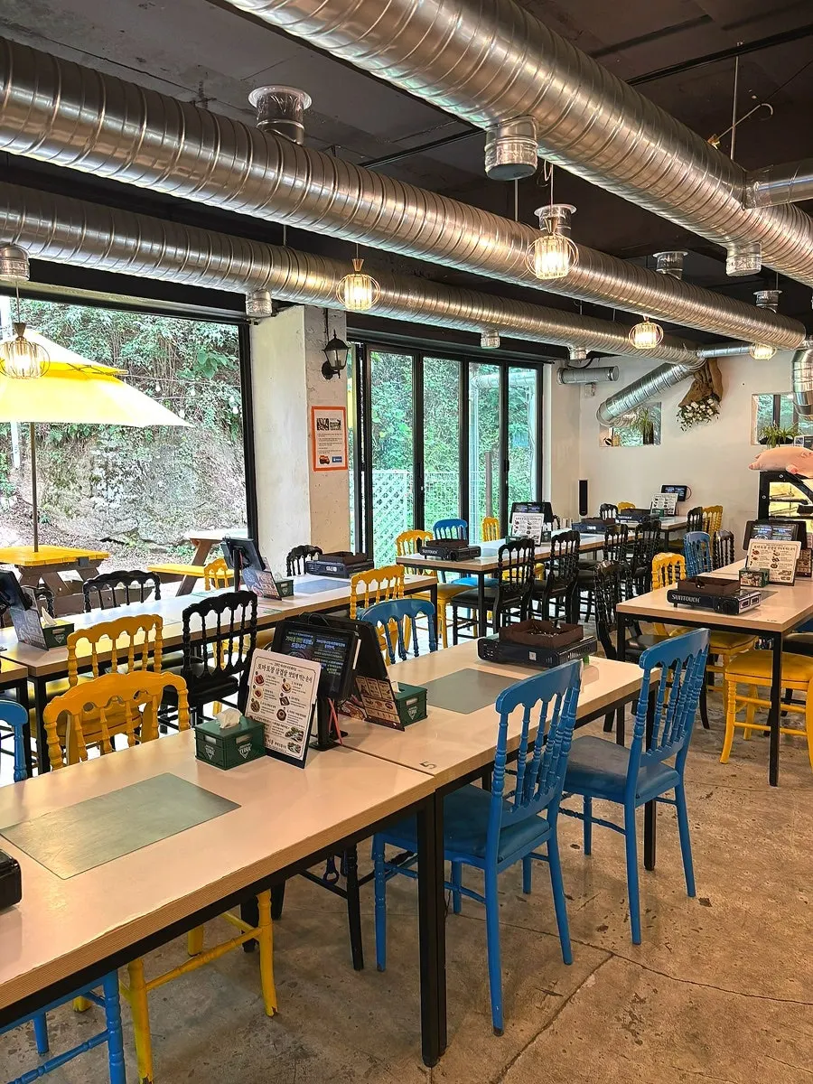 Outdoor terrace tables beside the creek
