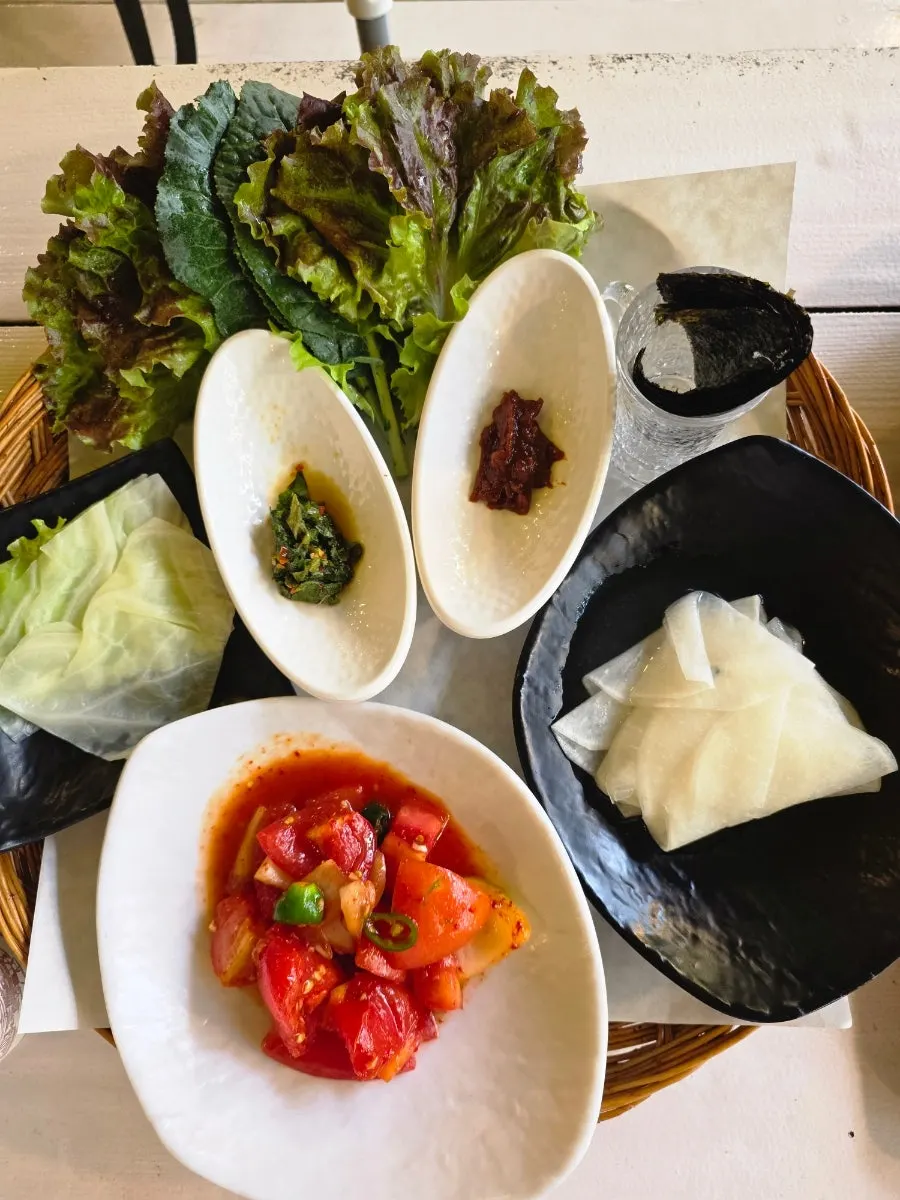 Raw jar-aged tomato-jang pork belly in red sauce