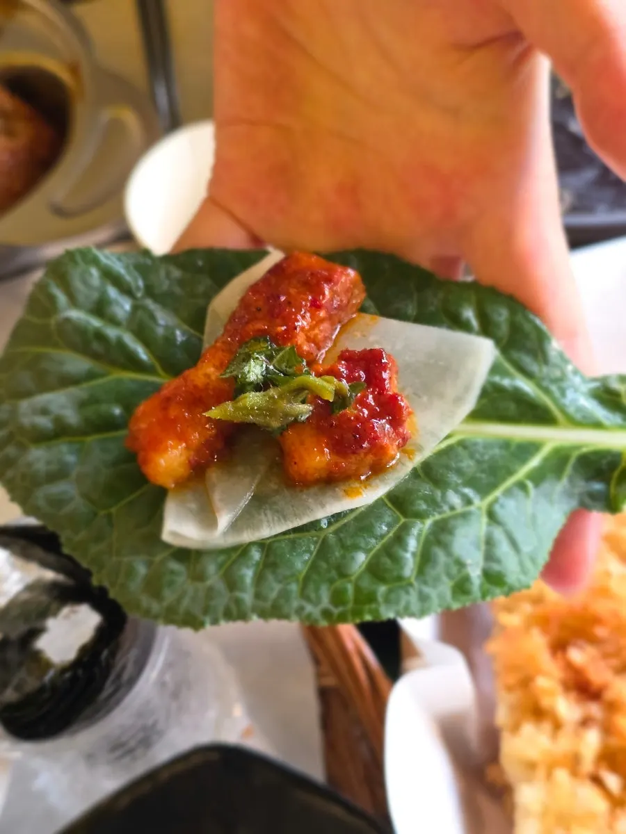 Tomato-jang pork belly wrapped in a wheat crepe