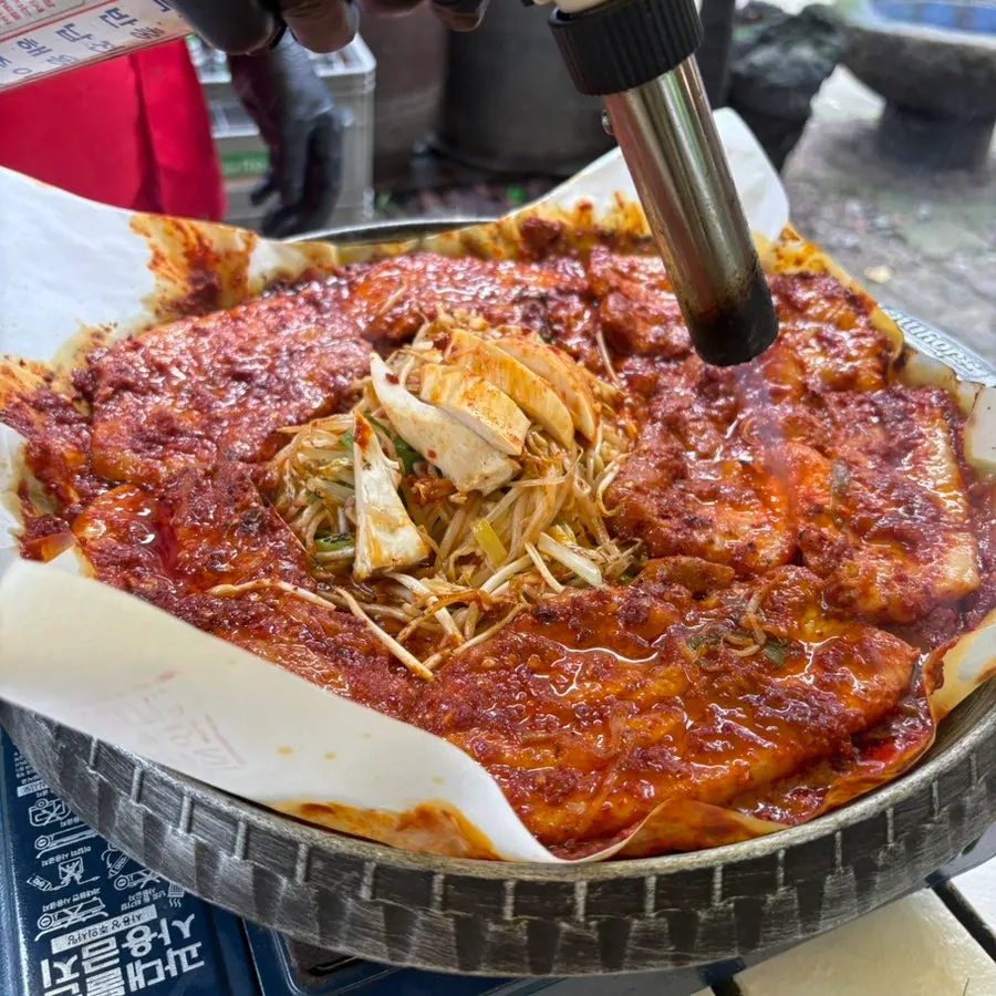 Staff grilling the tomato-jang pork belly