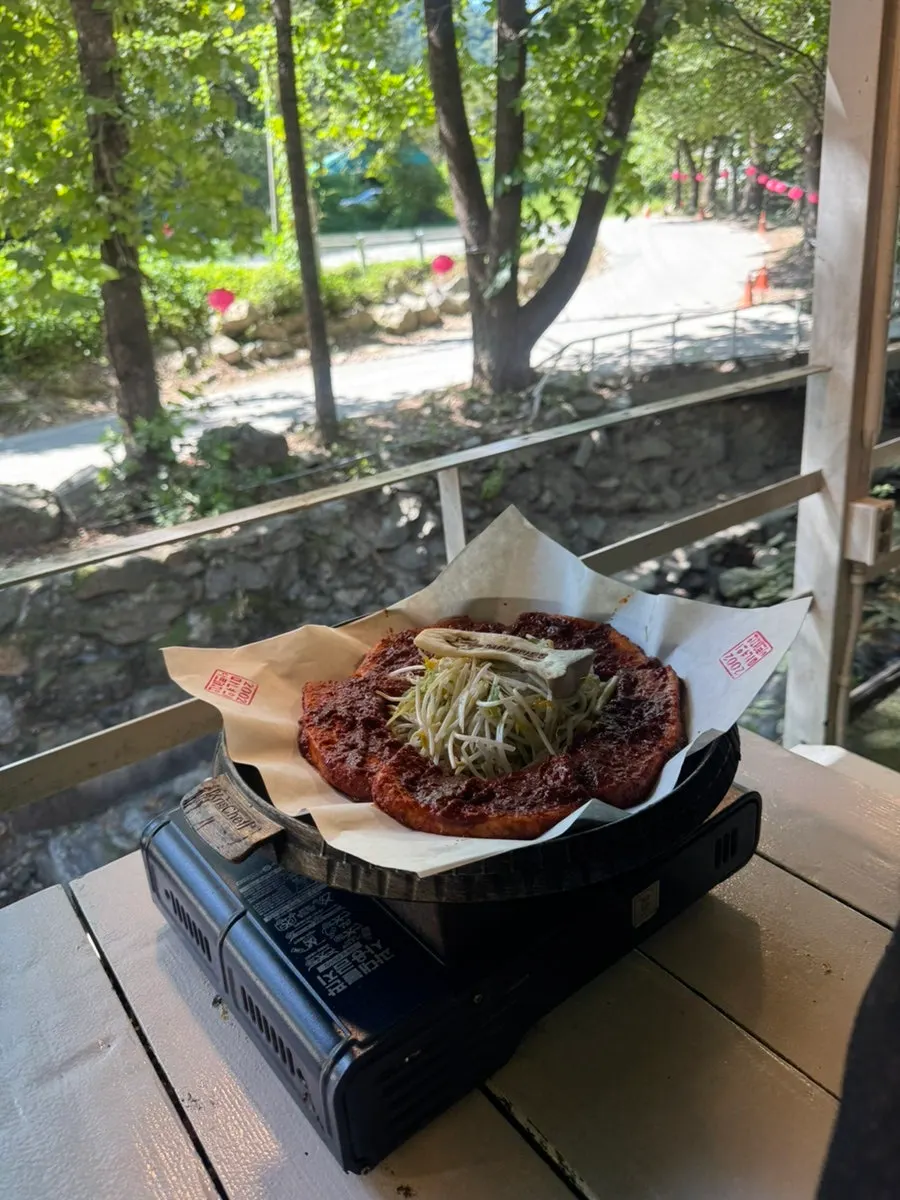 Two-serving spread of tomato-jang pork belly