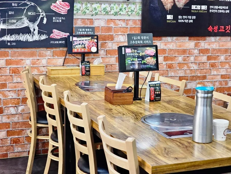 Well-spaced seating and group tables in the restaurant
