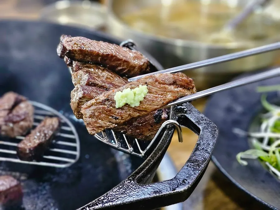 A piece of hanwoo sirloin topped with wasabi
