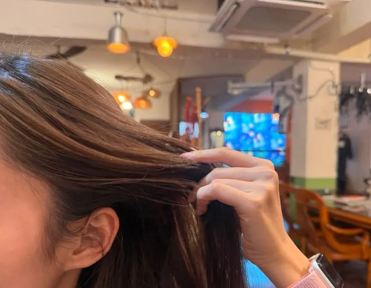 Hair before coloring with visible black roots