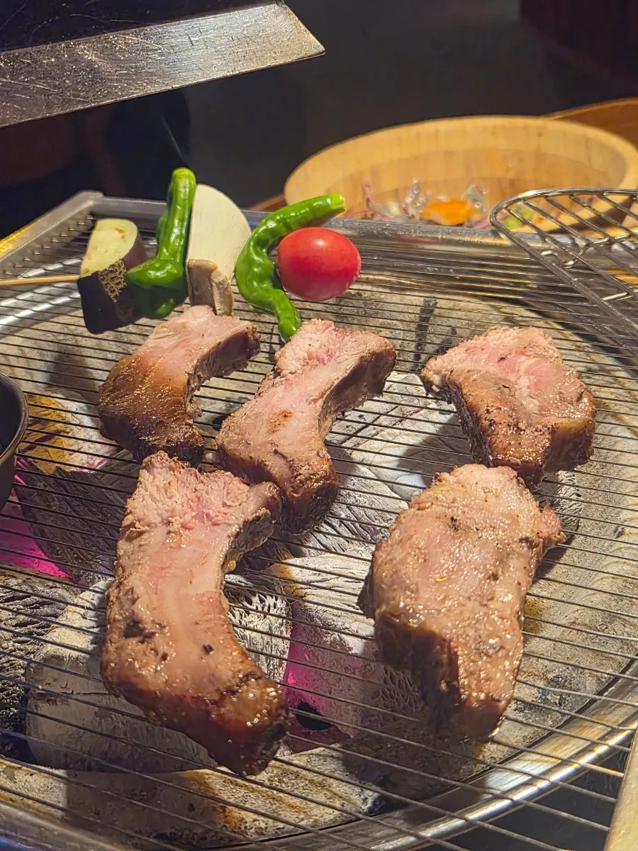 Par-cooked pork back ribs on the grill