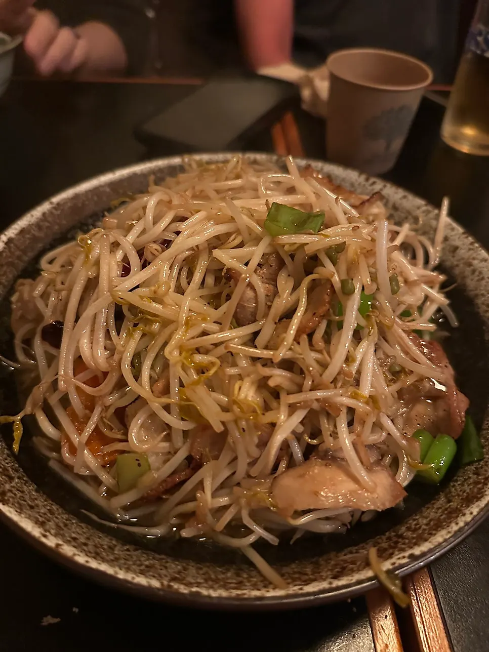 A generous plate of pork and bean sprout stir-fry
