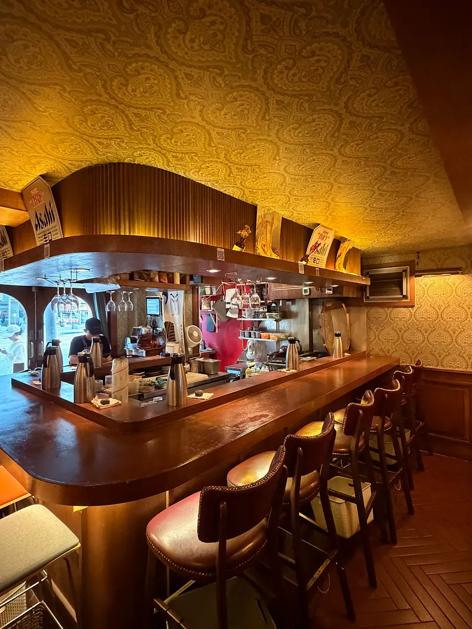 Izakaya seating under classic hanging lights