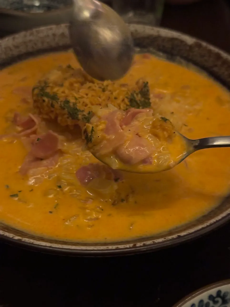 Scooping a spoonful of shin ramyun risotto