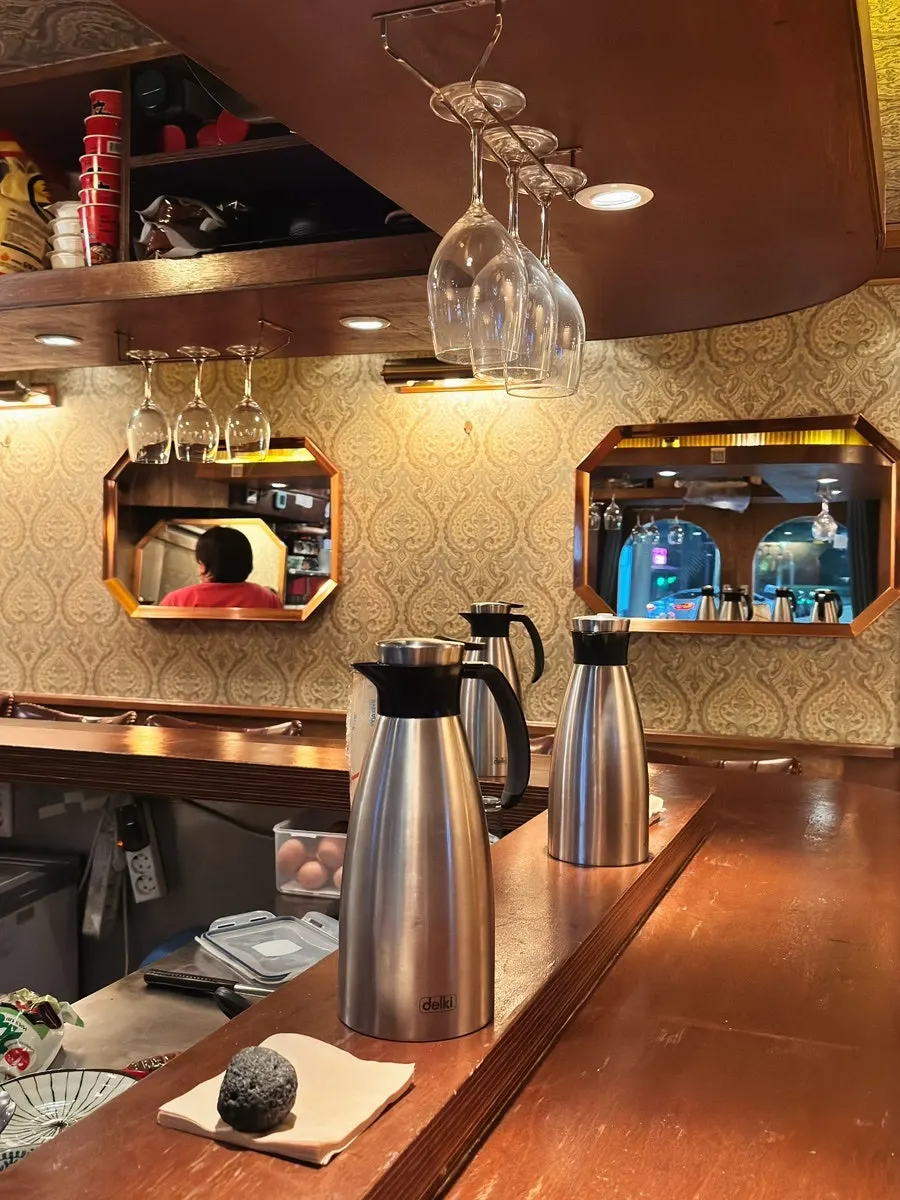 1st-floor bar seat line and table seats further inside
