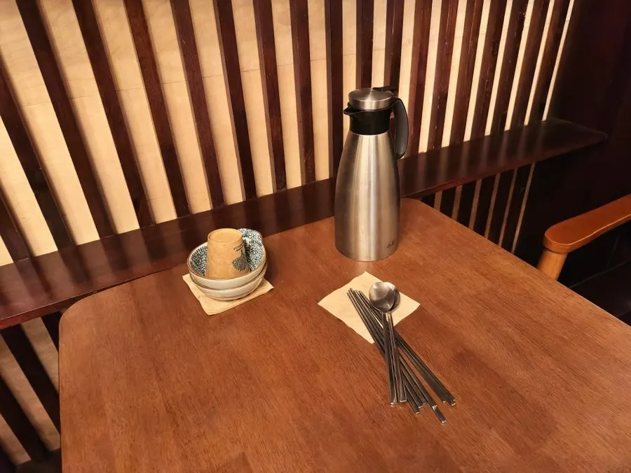 2nd-floor self-service line with bowls, utensils, and cups