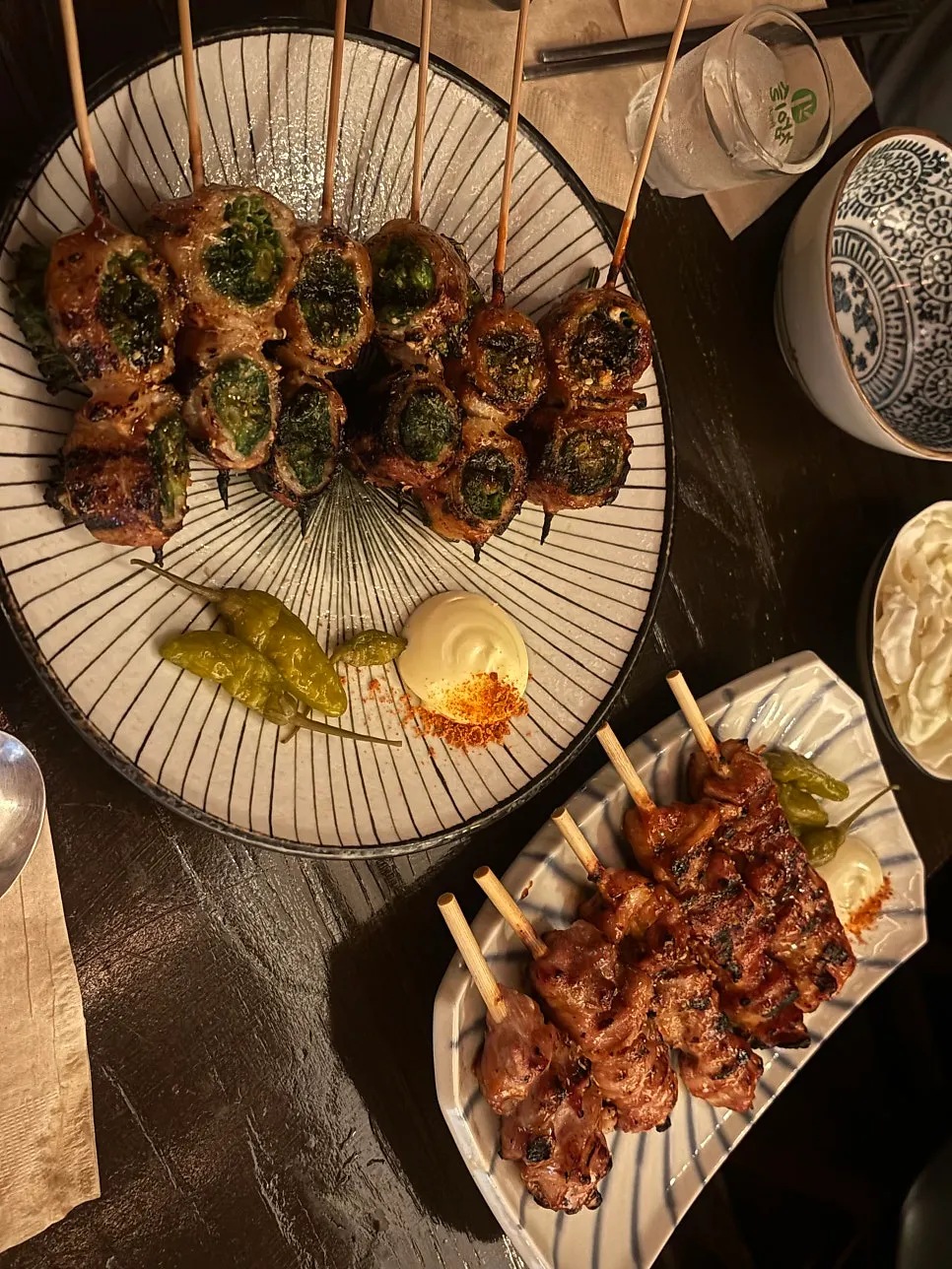 Vertical close-up of the pork belly scallion skewer