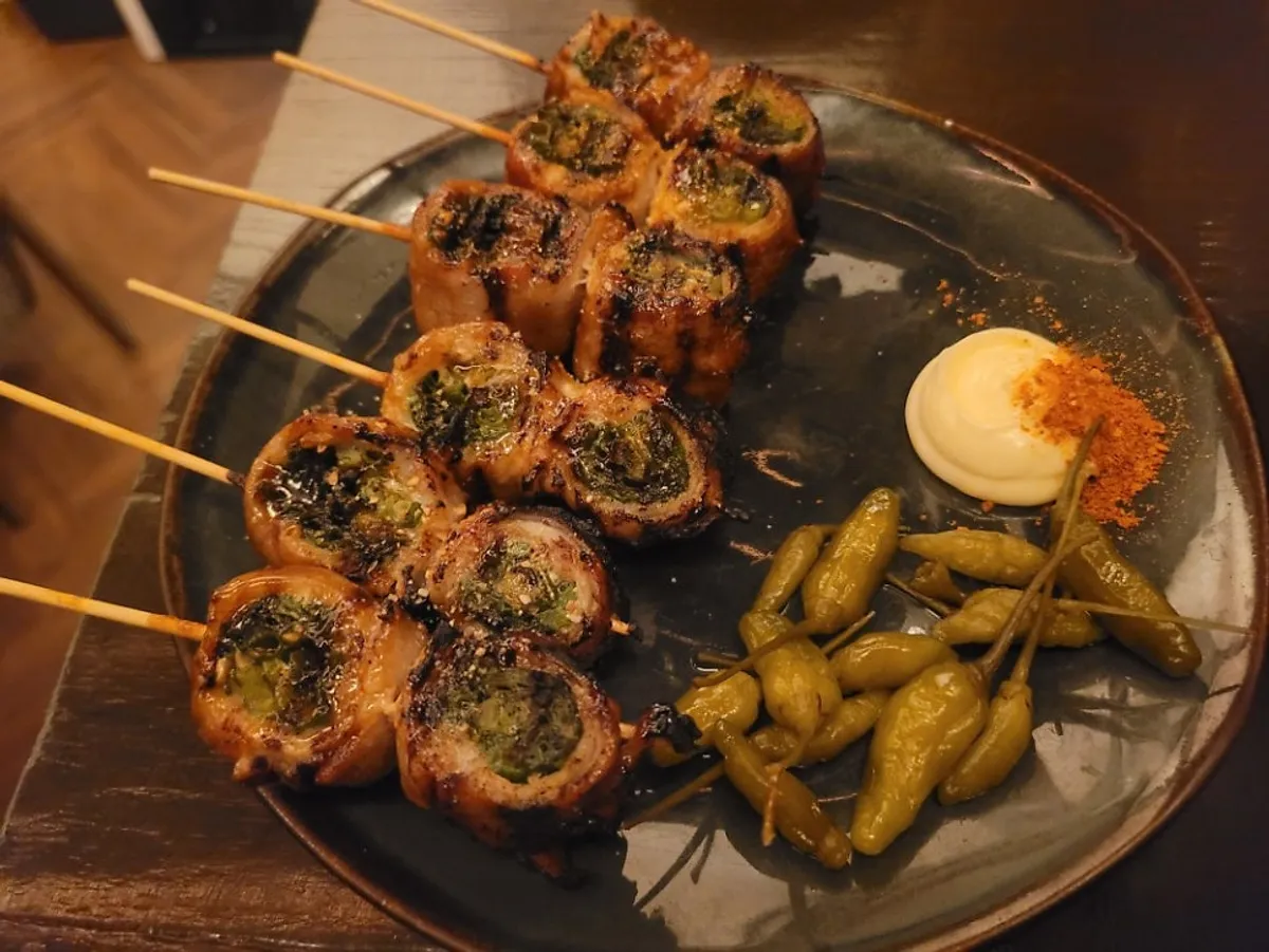 Pork belly and scallion skewer plate packed tight with scallions
