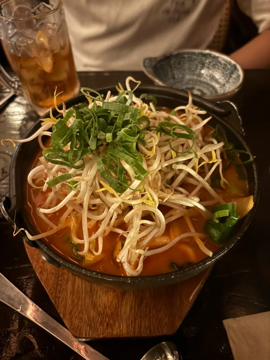 Table with soup dish and skewers together