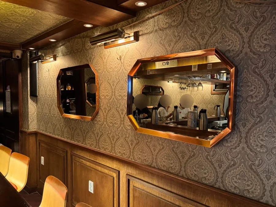 Bar counter seating at Nani Byeolgwan with a view of the kitchen