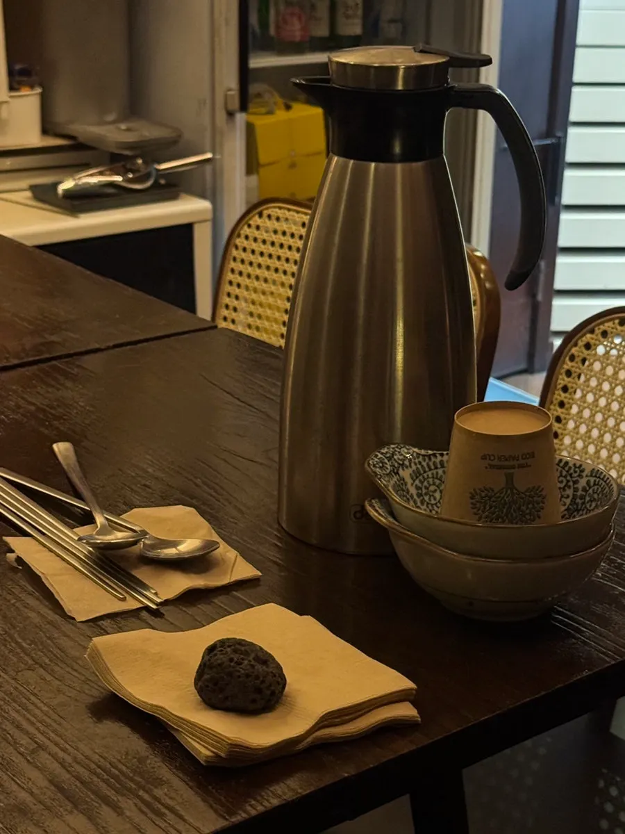 Table setting with napkins, utensils, and small plate