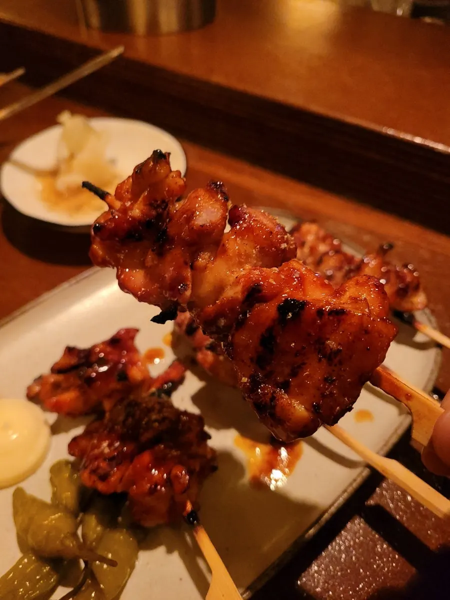 Seasoned and plain chicken skewers with pickled chili peppers and mayonnaise