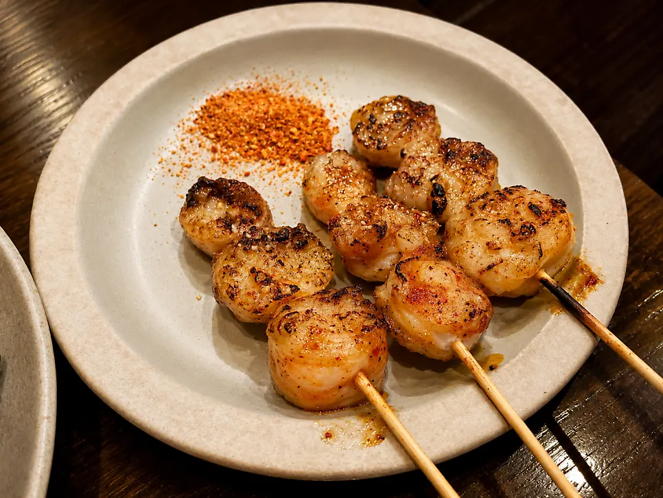 Three beef intestine skewers served together