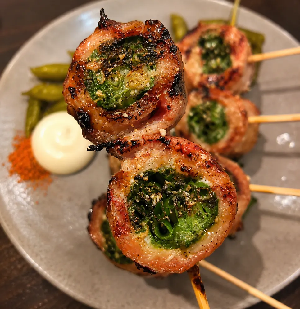Cross-section of a skewer with scallion wrapped in grilled pork belly
