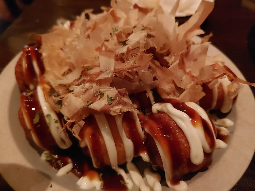 Takoyaki drizzled generously with sauce
