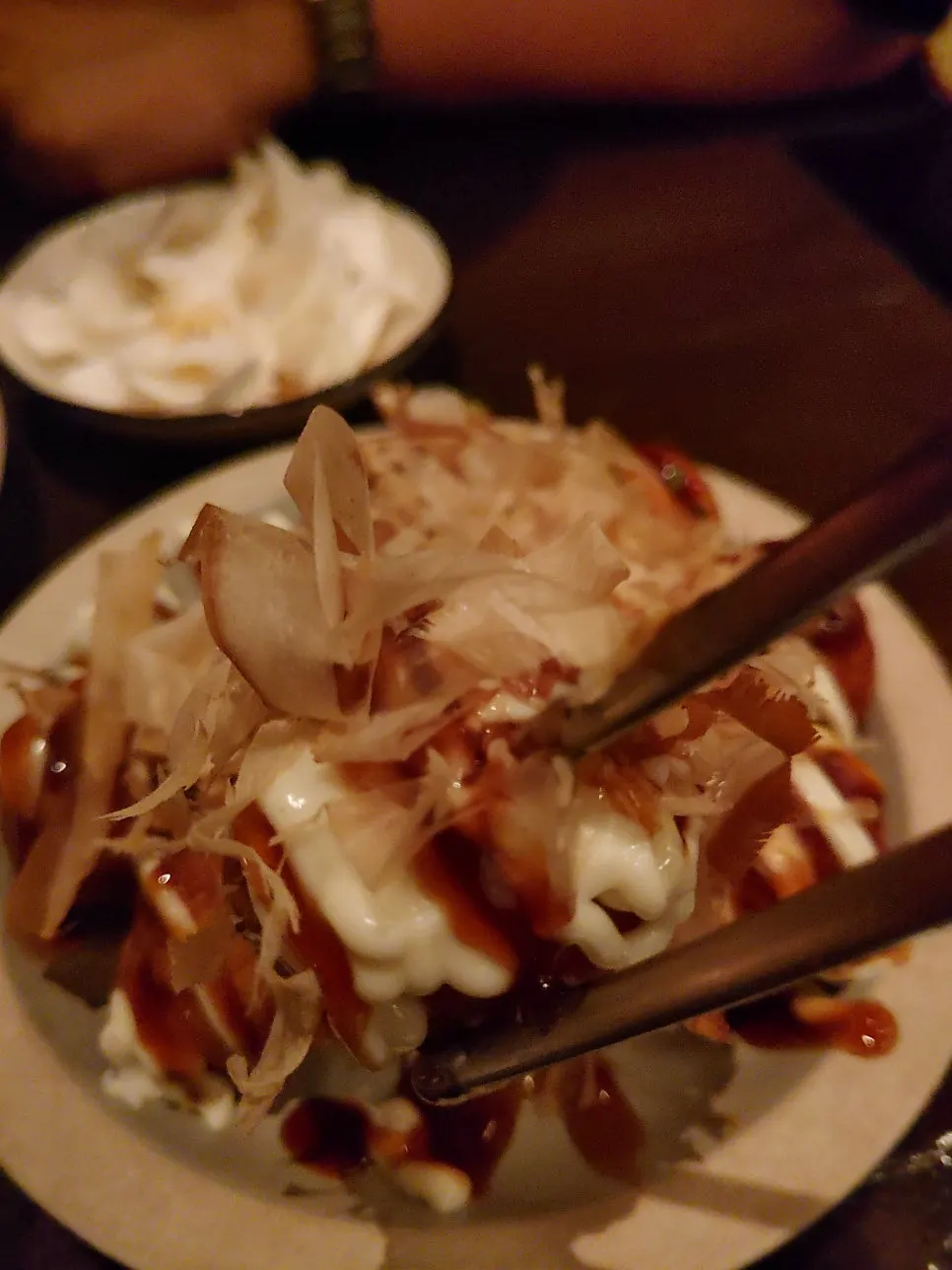 A takoyaki piece cut in half showing the inside