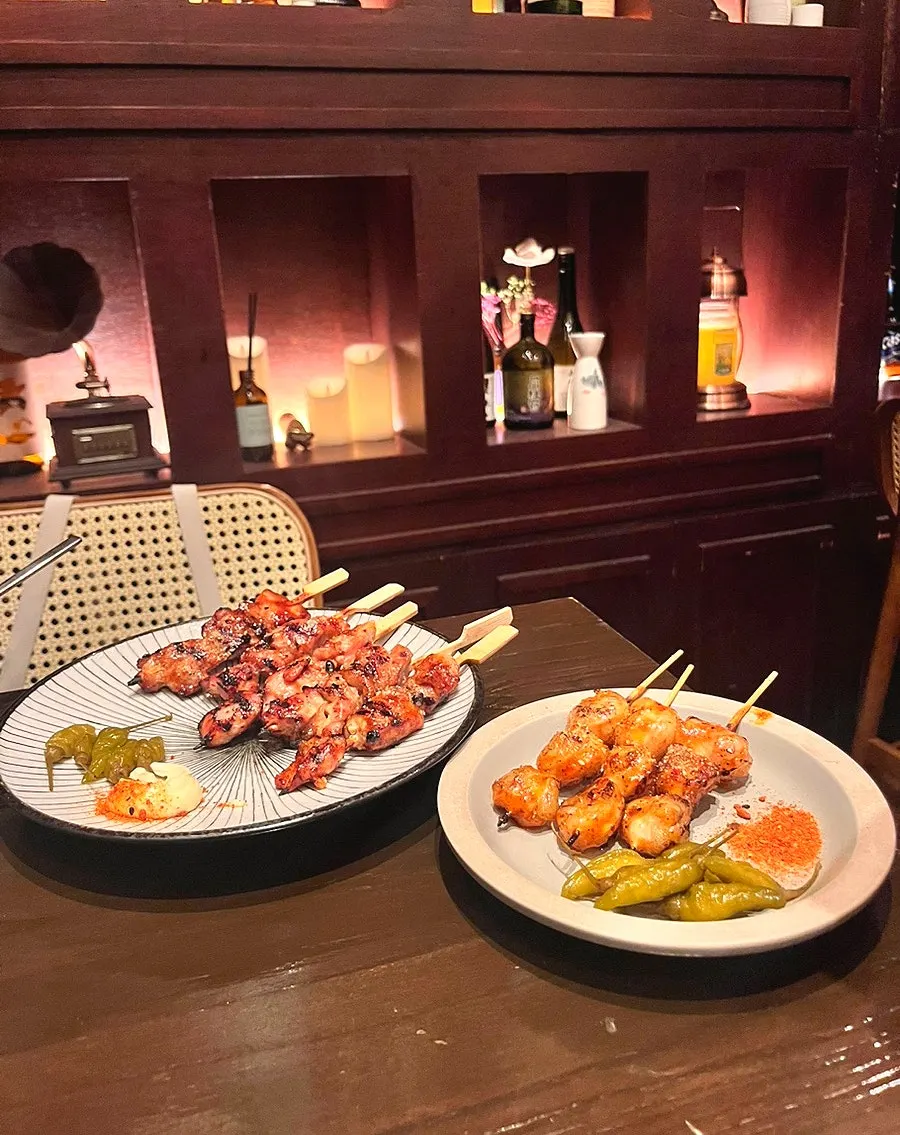 Three gopchang skewers served with mala powder