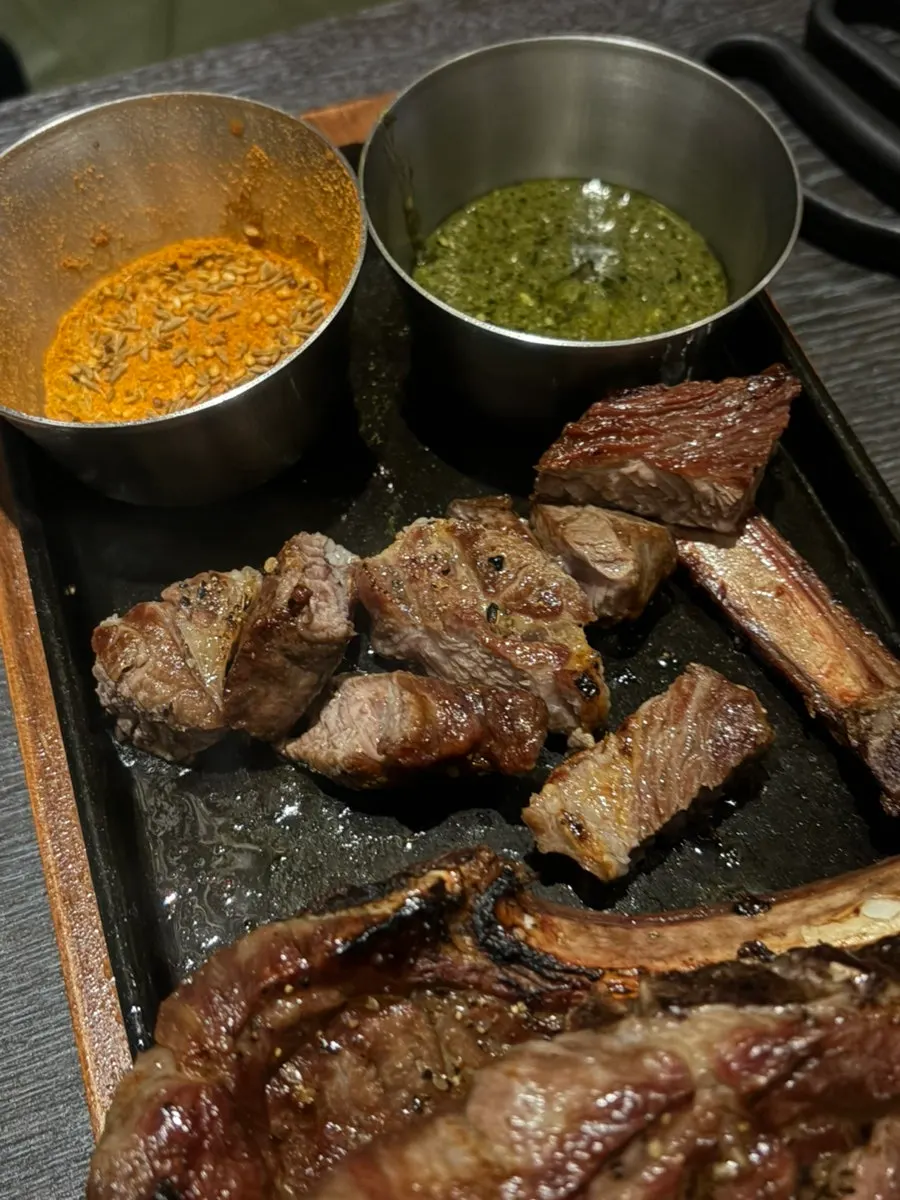 Shoulder rack served with cumin sauce and basil sauce