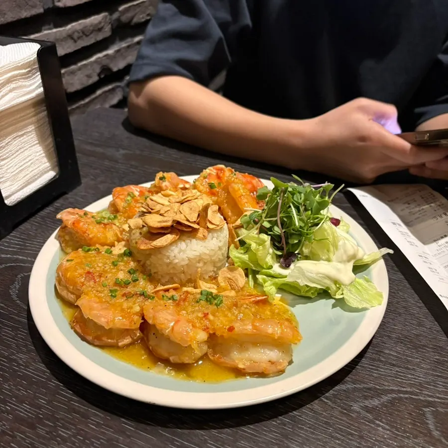 Close-up bite of the butter garlic king shrimp