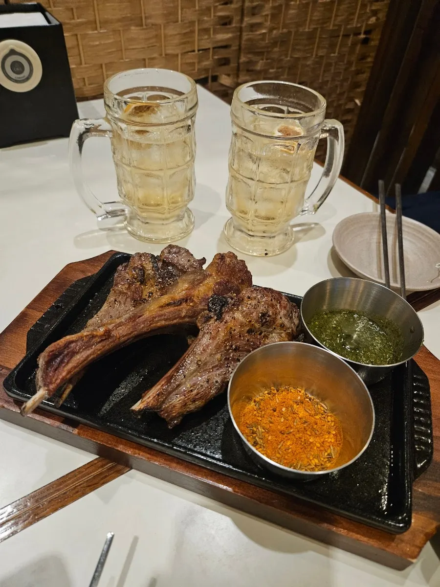 Three pieces of lamb shoulder rack served with cumin sauce