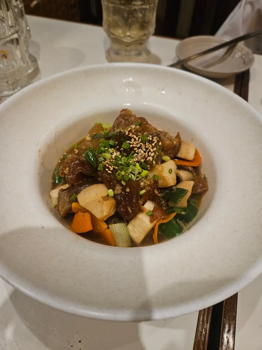 Shoyu-braised beef tendon with carrots, scallions, and mushrooms