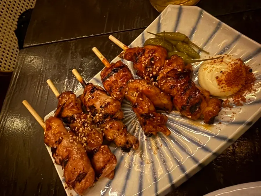 Skewers and snacks laid out on the table
