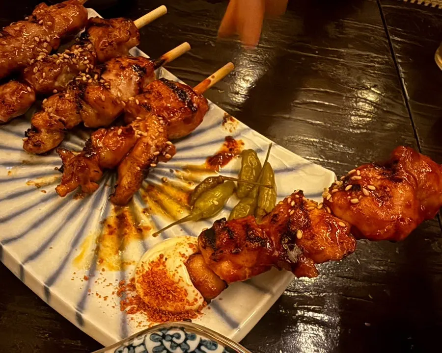 Chicken skewers dipped in mayonnaise