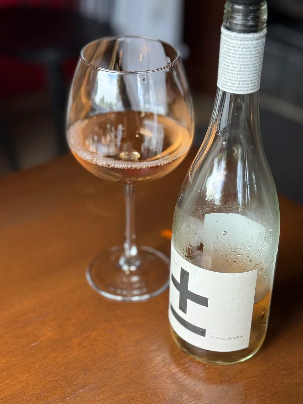 Non-alcoholic rosé wine poured into a glass