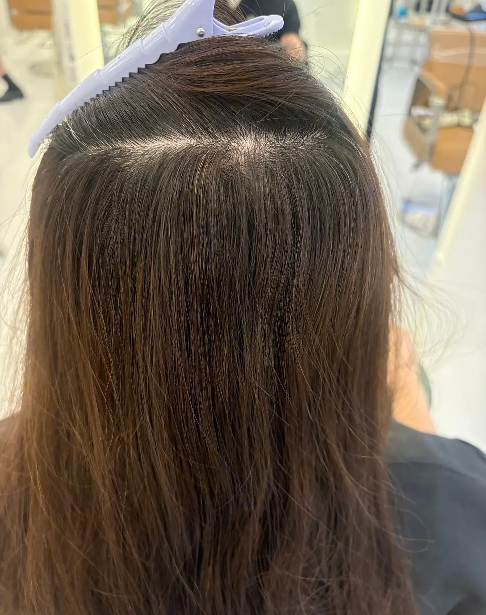 Before shot showing black roots grown in