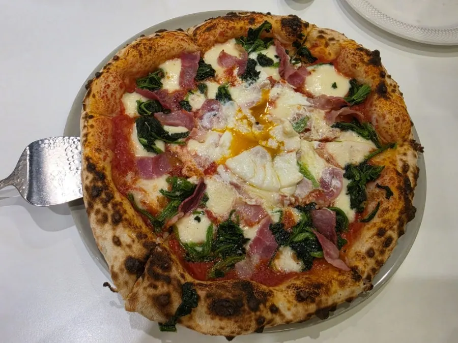 Freshly baked Bismarck wood-fired pizza