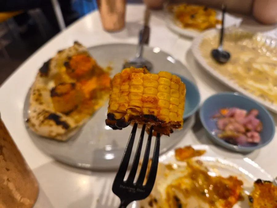 A slice of pizza served on a plate