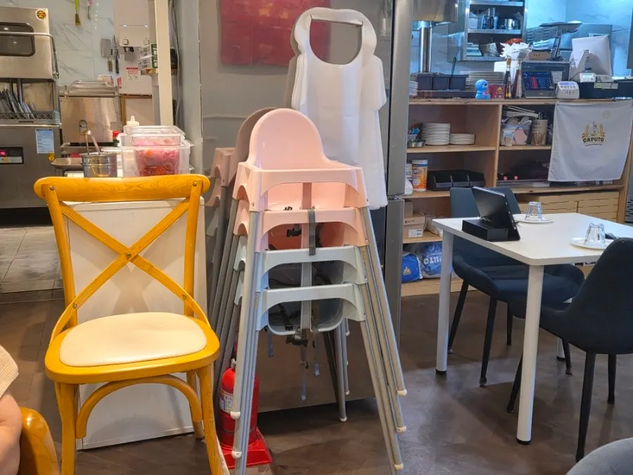 A baby chair set up in the restaurant