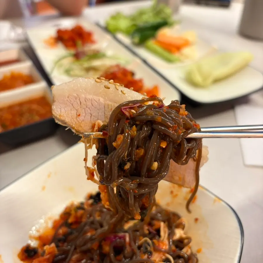 A bite combining bossam and makguksu