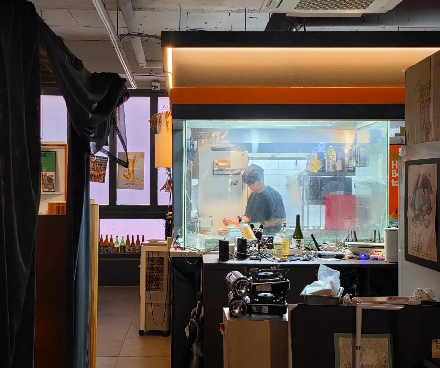Curtained partitions and open kitchen