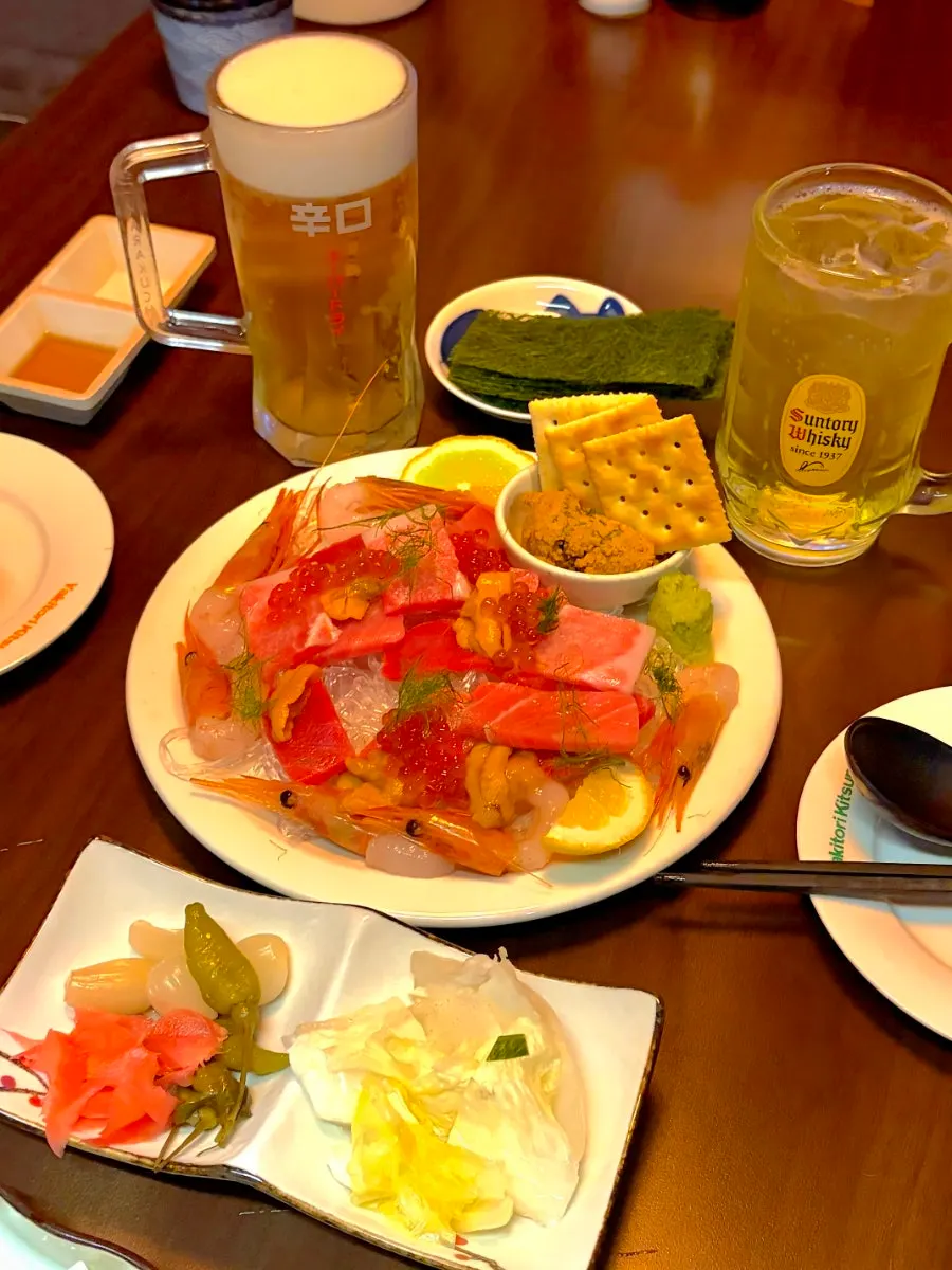 Bluefin tuna, uni, and sweet shrimp seafood table setting