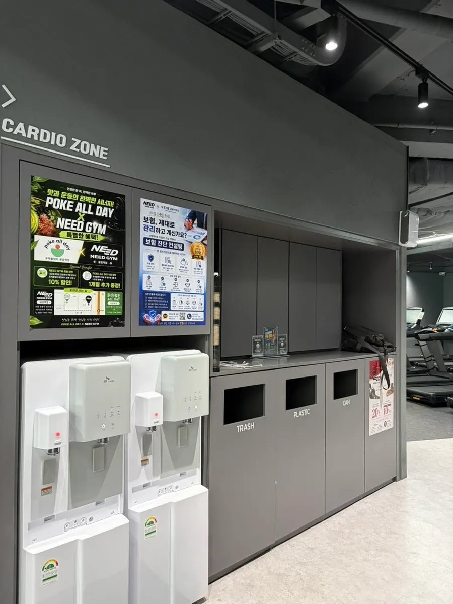 Cardio zone with screen-equipped treadmills