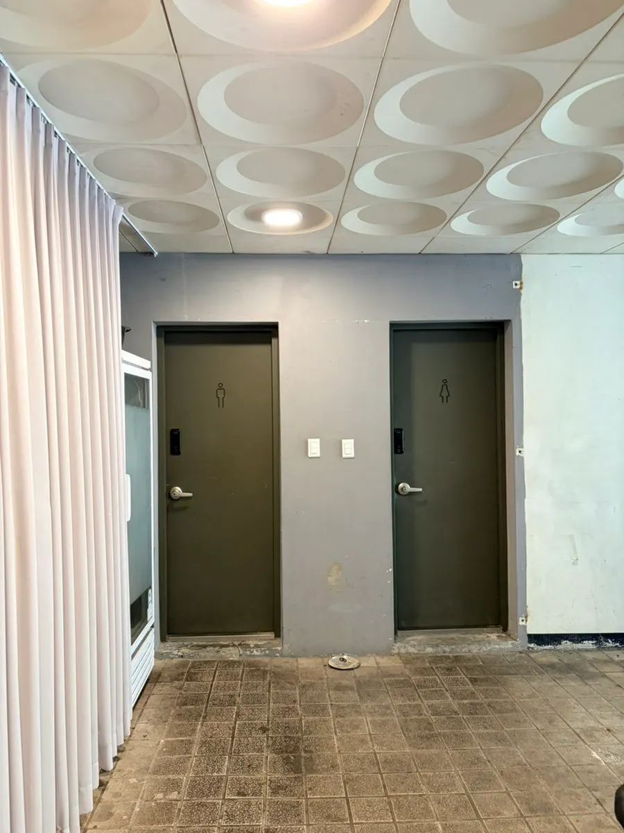 Passage connecting the back-door restroom and parking area