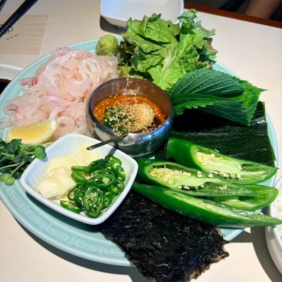 Sea bream sashimi with side vegetables