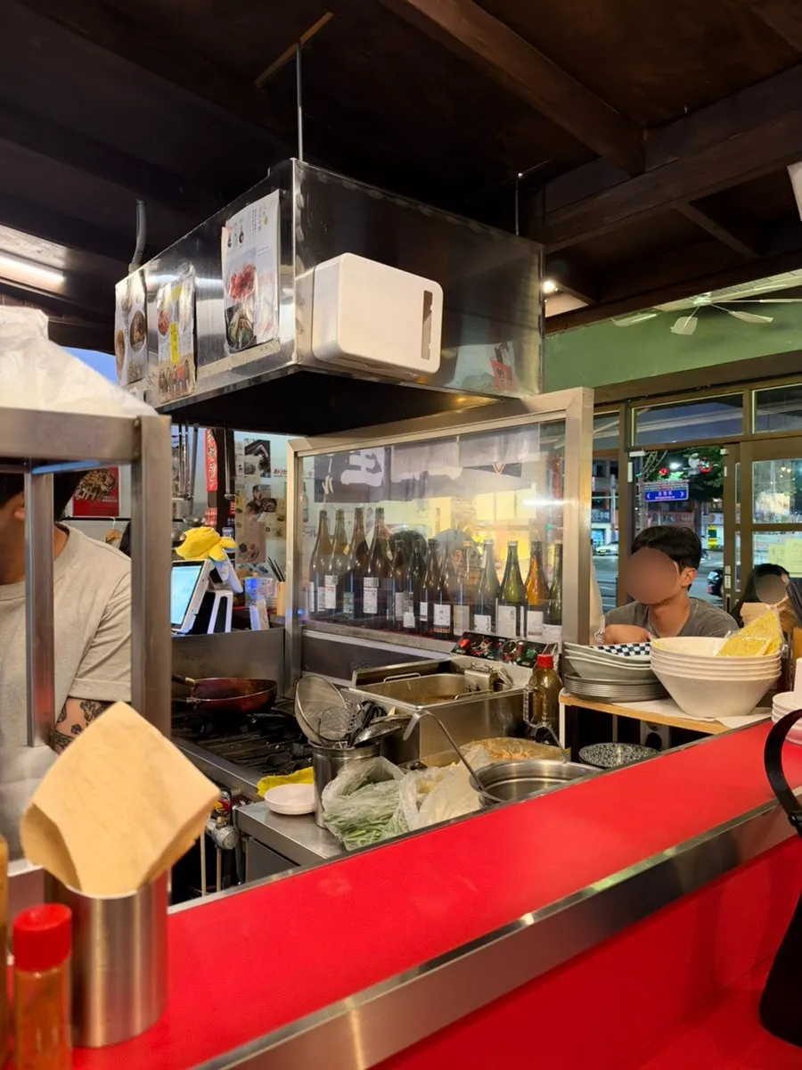 Beer crates used for storing bags behind the table