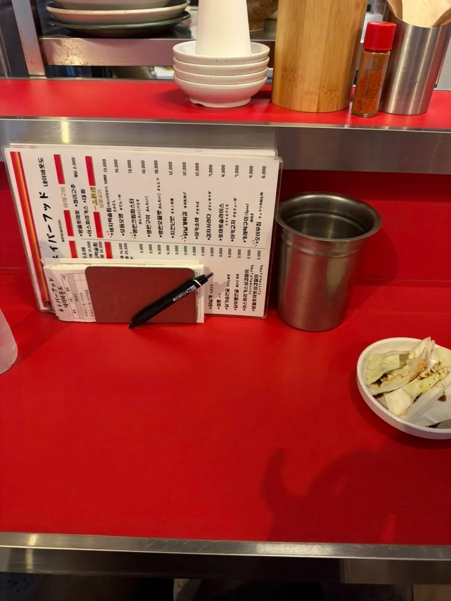 Yakitori being grilled beyond the bar table