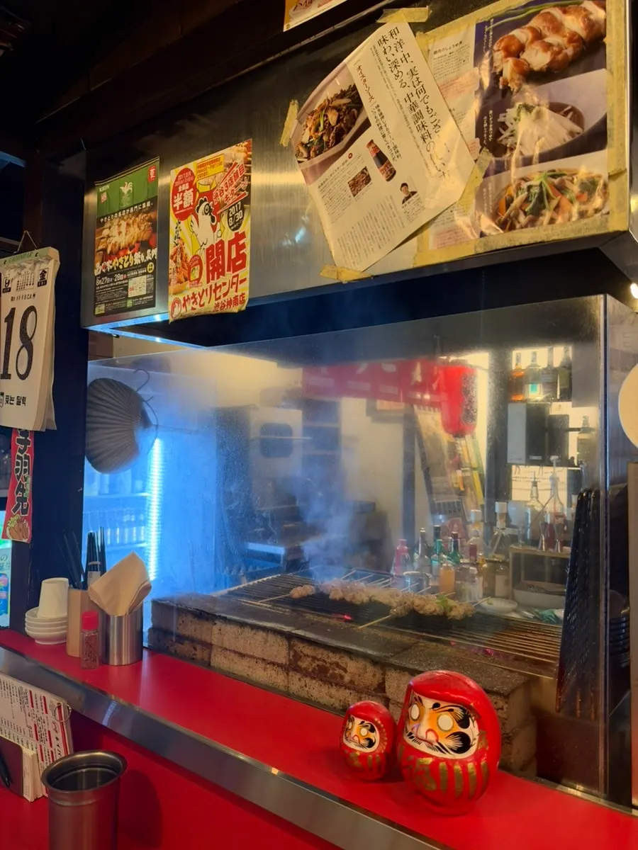 Yakitori grilling to a golden brown on the grill