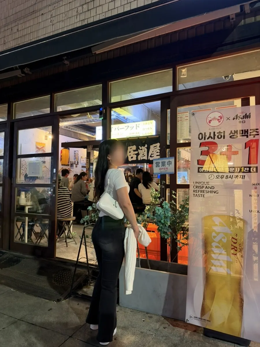 Glowing izakaya signage along the Gyodong street