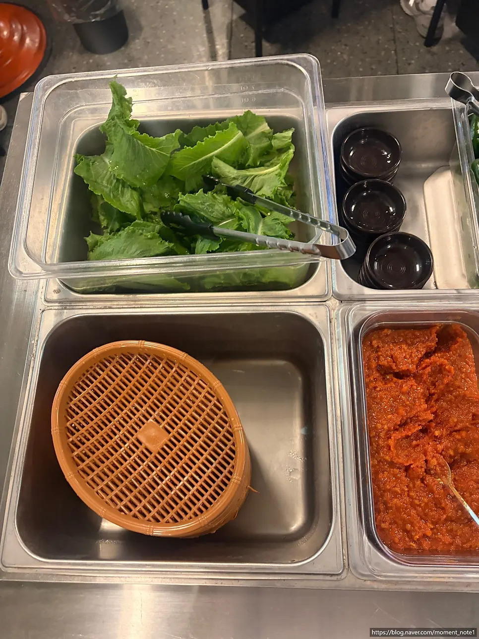 Aged kimchi and lettuce brought from the self-serve bar