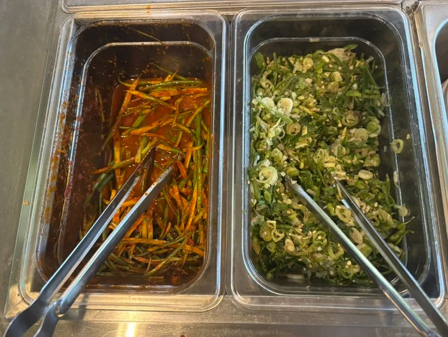 Salad and side dish spread at the self-serve bar